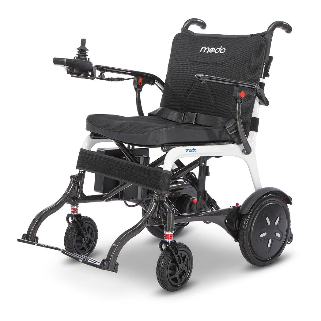 WHILL Modo Breeze lightweight folding power wheelchair — 28.6 lb carbon fiber, 8.66-inch folded profile, 300 lb capacity